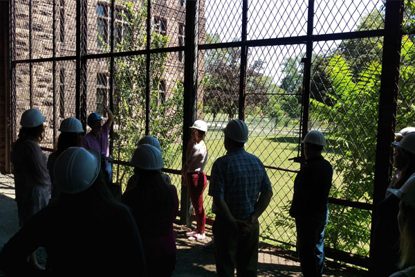 Photo of a docent leading a tour at the Richardson Olmsted Campus by Karen Streech